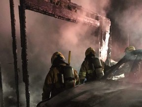 Firefighters at the scene of a fire that destroyed a shop and truck at a property in Georgian Bluffs just before midnight on Thursday, January 21, 2021.