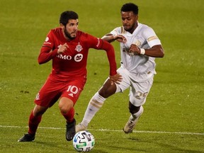 Plans have not been finalized, but Toronto FC midfielder Alejandro Pozuelo and his teammates (left) are hoping to play games at home this season. USA TODAY
