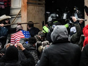 Supporters of U.S. President Donald Trump battle with police at the west entrance of the U.S. Capitol in Washington D.C. on Jan. 6, 2021. (Stephanie Keith/Reuters)