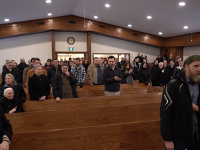 Dozens of congregants entered the Church of God in Aylmer during a drive-in service after Pastor Henry Hildebrandt invited them inside on Sunday. Police are investigating the incident, the town's police chief said. (YouTube)