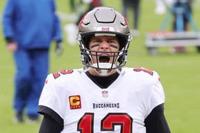 Quarterback Tom Brady of the Tampa Bay Buccaneers warms up prior to their NFC Championship game against the Green Bay Packers at Lambeau Field on Jan. 24, 2021 in Green Bay, Wisc..