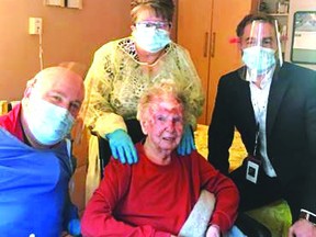 Photo supplied
Julie Trowbridge (in front) with Dr. Todd Spencer (left), Ludell North (RN), and Jeremy Stevenson (CEO), one of the first residents to receive the Moderna COVID-19 vaccine at St. Joseph’s Manor, Elliot Lake.