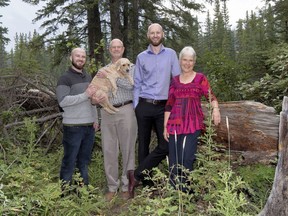 From left are Connor Hall, Wayne Hall, (holding dog Teddy), Evan Hall and Joanne Danyluk-Hall. photo by Pam Doyle/www.pamdoylephoto.com