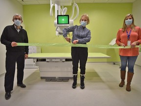 Lena Koiv (center), representing the over 950 donors to the Digital X-Ray Campaign proudly cut the ribbon on CMHÕs new Digital X-Ray Machine. Pictured with Lena, Varouj Eskedjian (left), CEO of CMH and Colleen Smith (right), Manager of Diagnostic Imaging. CAIT LAVOIE PHOTO