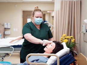 A student in the PSW program at Conestoga College does some training. The school has launched a new fast-track program for personal support workers.