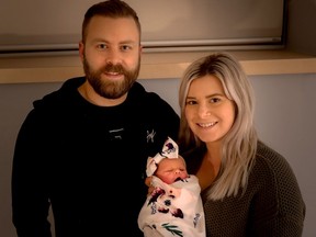 Camilla Loomis, Brockville's first baby of 2021, poses with parents Miranda Clow and Justin Loomis at Brockville General Hospital. (SUBMITTED PHOTO)