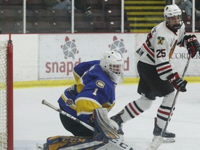 Carleton Place goalie Devon Levi and Brockville forward Ryan Gillespie get ready for a Braves' scoring chance during a CCHL game at the Brockville Memorial Centre on Jan. 31, 2020. Levi made 30 saves and was named first star as he and the Canadians shut out the Braves 2-0.
File photo/The Recorder and Times