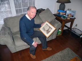 Bob Runciman holds a picture of his dad, Sandy. Wayne Lowrie/Recorder and Times