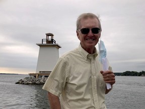 Former senator Bob Runciman stands on a boat as it passes by the Five Mile Light in September. (FILE PHOTO)