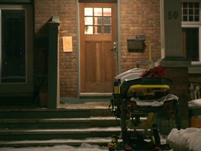 A gerney sits outside the home of a suspected COVID-19 patient's home in Ottawa as paramedics assess, as seen on Jan. 25, 2020. Jordan Haworth/Cornwall Standard-Freeholder/Postmedia Network