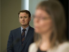 Health Minister Tyler Shandro looks on as Alberta's chief medical officer of health Dr. Deena Hinshaw provides a COVID-19 update, during a press conference in Edmonton Thursday April 9, 2020. PHOTO BY DAVID BLOOM /Postmedia file