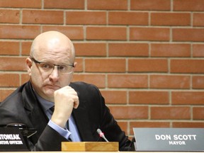 Mayor Don Scott listens to presenters during a meeting on Tuesday, October 9, 2018. Vincent McDermott/Fort McMurray Today/Postmedia Network