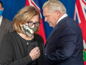 Ontario Associate Medical Officer of Health Dr. Barbara Jaffe walks to the podium to speak after Premier Doug Ford at a daily briefing at Queen’s Park in Toronto on Friday, Jan. 8, 2021.