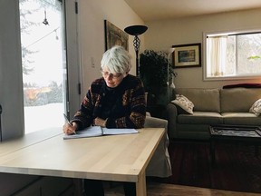 Susan Young does some writing at home.