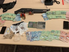 Drugs, cash and weapons seized by Kingston Police during a drug trafficking investigation in the city.