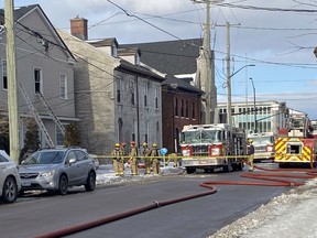 Kingston Fire and Rescue respond to a house fire on Wellington Street between Johnson and William streets on Wednesday.