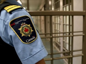 A correctional officer watches over the maximum security unit during a tour of the Collins Bay Institution on Tuesday May 10 2016. on January 20, 2021 CSC announced that vaccines for elderly and medically challenged offenders are currently being administered. Ian MacAlpine /The Whig-Standard/Postmedia Network
