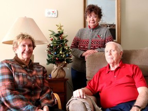 Barb Jenkins (seated left) and Gwen Hundrieser, Rotarians who volunteer with the Food Bank, visited with philanthropist Jack Keyes on December 12, 2019. Keyes donated $20,000 to the Food Bank in Gananoque that year to help purchase cheese and fresh produce.  
Lorraine Payette/For Postmedia Network