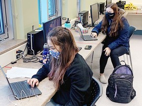 Grade nine Esc l'Envolée du Nord students Alexa Gagné and Kaylee Pelletier are using CAD softwear to design a 3D project that they are printing with the school's 3D printer. Supplied photo