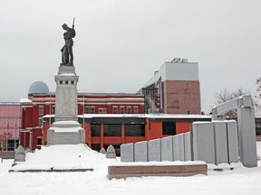 The building that formerly housed Royal Canadian Legion Branch 23 is seen behind the North Bay War Memorial at First Avenue West and Ferguson Street, Tuesday. Michael Lee/The Nugget