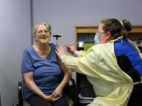 Nora Foster receives the Pfizer BioNTech COVID vaccine from RPN Danielle McNabb Friday. The seniors home resident at Golden Dawn in Lion's Head is the first in Bruce County to get the vaccine. (Supplied photo)