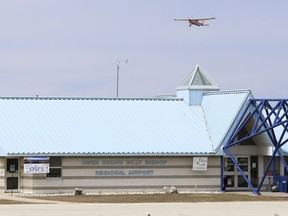 A single engine plane takes off over the Owen Sound Billy Bishop Regional Airport terminal building in this file photo.