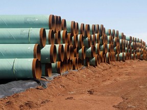 Miles of pipe for the stalled Canada-to-Texas Keystone XL pipeline are stacked in a field near Ripley, Okla., in this Feb. 1, 2012 file photo.