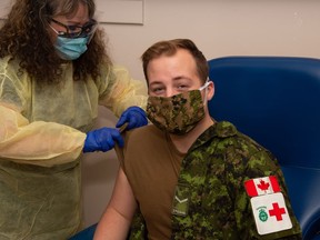 2 Field Ambulance Medical Technician, Private Connor Doucette receives his COVID-19 vaccination at Garrison Petawawa on Thursday, Jan. 7. Photo by Aviator Lanny Jellicoe, Garrison Imaging Petawawa