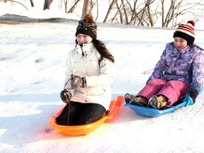 Sisters Megan, 14, (left) and Katie Morrow enjoyed a few trips down the sliding hill behind the Carefor MacKay Centre on Jan. 9, 2021. The conditions on the hill were near perfect as family enjoyed the time-honoured winter tradition as they got out for some fresh air and physical activity. Tina Peplinskie