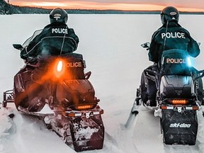 File photo of OPP officers on snowmobiles.