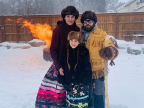 Isabella Kulak poses with her parents Lana and Chris Kulak. 
Stella Pelly / Facebook Photo