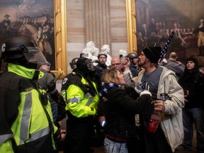 Pro-Trump protesters storm the U.S. Capitol during a rally to contest the certification of the 2020 U.S. presidential election results by the U.S. Congress, at the Capitol in Washington, D.C., on Jan. 6.