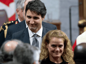 Prime Minister Justin Trudeau follows Gov. Gen. Julie Payette as she leaves the Senate Chamber following the throne speech late in 2019.