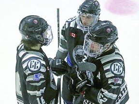 The Express trio of Josh Kavanagh, A.J. Favot and Ben Anderson, during a break in the action against the Soo Thunderbirds. CHELSEA SOLOMON