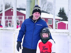 GAME ON Jorden Rainone and his son Sam take to the Merrifield rink to work on their hockey skills. ALLANA PLAUNT/SAULT THIS WEEK