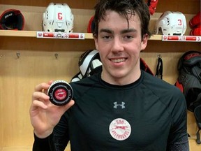 Photo provided

Greyhounds defenceman Jacob Holmes is all smiles while holding the puck he used to score his first OHL goal