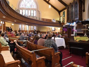 The final service at Central United Church in Sarnia is pictured Nov. 15, 2020. Rev. Wendy Milliken is pictured leading the service. The sanctuary is being preserved, and apartments are being eyed for other parts of the church building, its new owners say.
