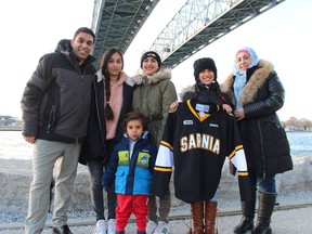 The first family of Syrian refugees to reach Sarnia five years ago, from left, Mohamad Al-Khalil, Roaa Al-Khalil, 15, Weasam Al-Khalil, 3, Raghd Al-Khalil, 13, Rahaf Al-Khalil, 11, and Diana Al-Khalil, have built a new life in the community.
