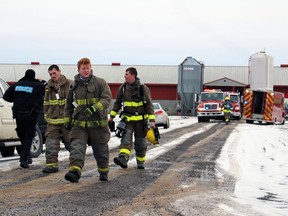 Warwick firefighters walk away from a pig barn where an electrical fire sparked on Wednesday January 6, 2021 in Warwick Township, Ont. Terry Bridge/Sarnia Observer/Postmedia Network