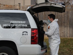 Sarnia police investigate a homicide scene on Lee Court where a woman died Thursday.