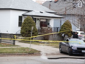 A police vehicle backs into the driveway at 282 Essex St. in Sarnia Monday, where police were investigating the death of Sue Elin Lumsden,. found dead in her home Jan. 23, as a homicide. (Tyler Kula/The Observer)