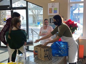 Volunteers helped serve 182 meals during the first drive-through, pickup Christmas Dinner on Christmas Day. The dinner was prepared by members of Lighthouse Church through their outreach program, Food For the Soul, in partnership with New Life Community Church in Stony Plain and Immanuel Lutheran Church in Rosenthal. Submitted photo.