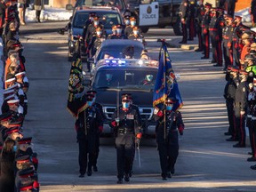 Funeral procession for Calgary police officer Sgt. Andrew Harnett at the Calgary Police Service headquarters in Calgary, Ab., on Saturday. Harnett, a native of Hagersville, was killed in the line of duty. Mike Drew/Postmedia