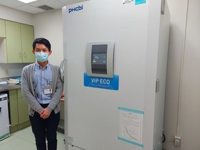 Kang-Wei (David) Liu, director of pharmacy at Norfolk General Hospital and West Haldimand General Hospital, stands by the COVID-19 vaccine freezer at NGH. The Simcoe hospital has received its first shipment of vaccines. CONTRIBUTED PHOTO