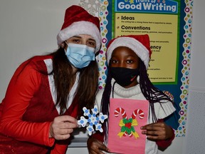 Students in Grade 5 and SK/1 at St. David School worked hard on spreading some Christmas cheer and funny jokes to long-term care and senior homes. The students wanted to make sure those seniors who are not able to see their families and friends this Christmas due to COVID-19 restrictions were pleasantly surprised with a nice Christmas card and a handmade ornament. The students have been discussing the true meaning of Christmas; celebrating Jesus' birth; however, they wanted to give back to the Sudbury community in a way that was much more personal and heart felt this year. They felt the need to make a difference through their kind words and art that made someone's Christmas a little brighter. Helping to spread the good cheer are Ms. Rocca and Morine Phillips. Supplied