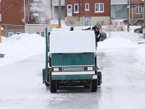A Zamboni is used to build up the ice surface at the Queen's Athletic Field skating oval in Sudbury, Ont. on Monday January 4, 2021.