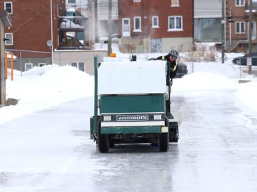 A Zamboni is used to build up the ice surface at the Queen's Athletic Field skating oval in Sudbury, Ont. on Monday January 4, 2021. John Lappa/Sudbury Star/Postmedia Network
