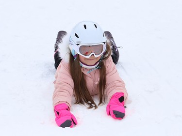 Isabella Collin, 7, takes a break from snowboarding at Bell Park in Sudbury, Ont. on Monday January 4, 2021. John Lappa/Sudbury Star/Postmedia Network