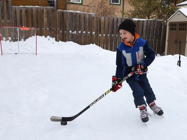 Carter Kuczma, 7, hones his hockey skills on a backyard rink at his home in Sudbury, Ont. on Wednesday January 6, 2021. John Lappa/Sudbury Star/Postmedia Network