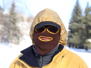 Dennis Adams attempts to keep warm while going for a walk in Copper Cliff, Ont. on Friday January 8, 2021. John Lappa/Sudbury Star/Postmedia Network